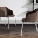 Chair upholstered in leatherette with chromed steel frame