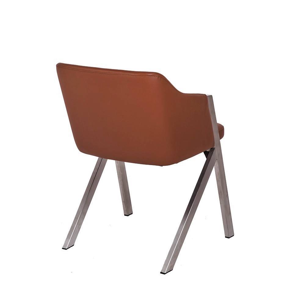 Chair upholstered in leatherette with polished steel frame