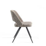 Chair upholstered in fabric with black steel legs