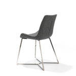 Chair upholstered in fabric with chrome steel legs