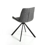 Swivel chair upholstered in fabric with black steel legs