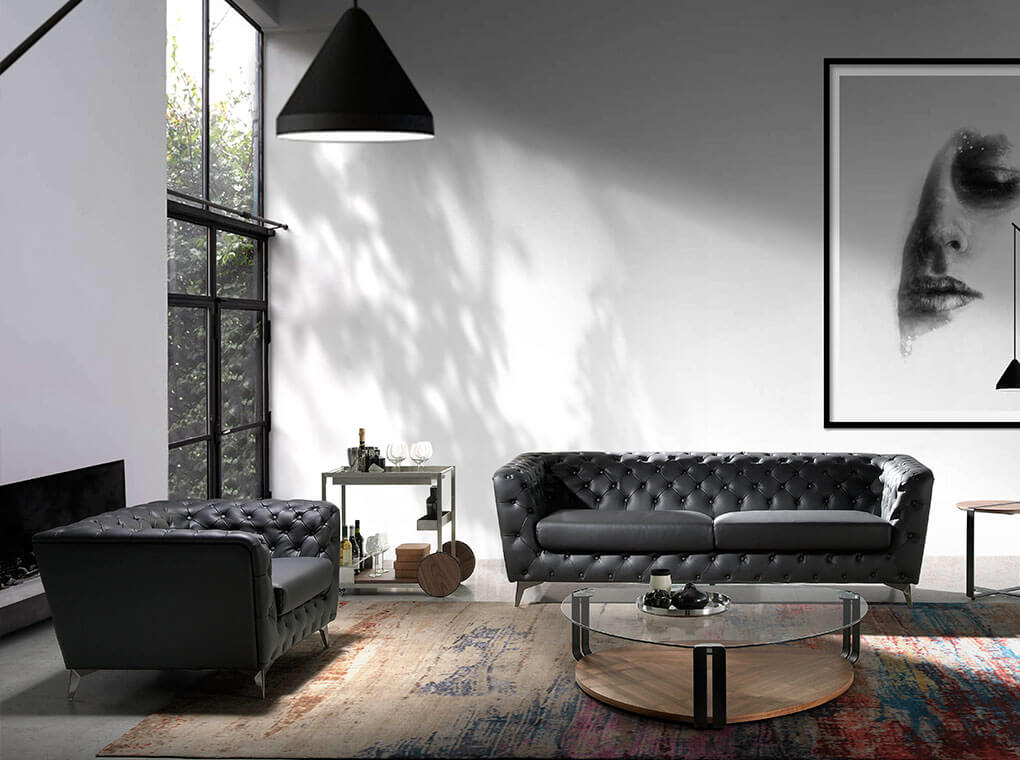 Armchair upholstered in leather with capitone effect Armchair upholstered in leather with capitone effect