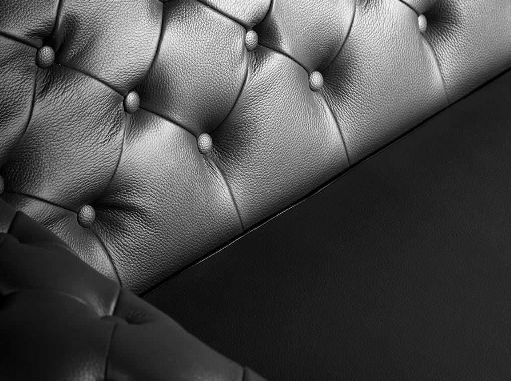 Armchair upholstered in leather with capitone effect Armchair upholstered in leather with capitone effect