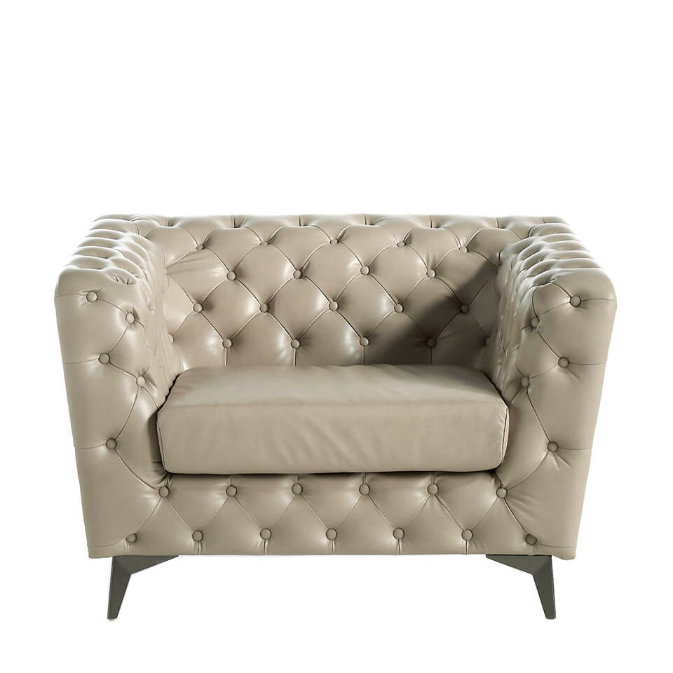 Armchair upholstered in leather witn capitone effect Armchair upholstered in leather witn capitone effect