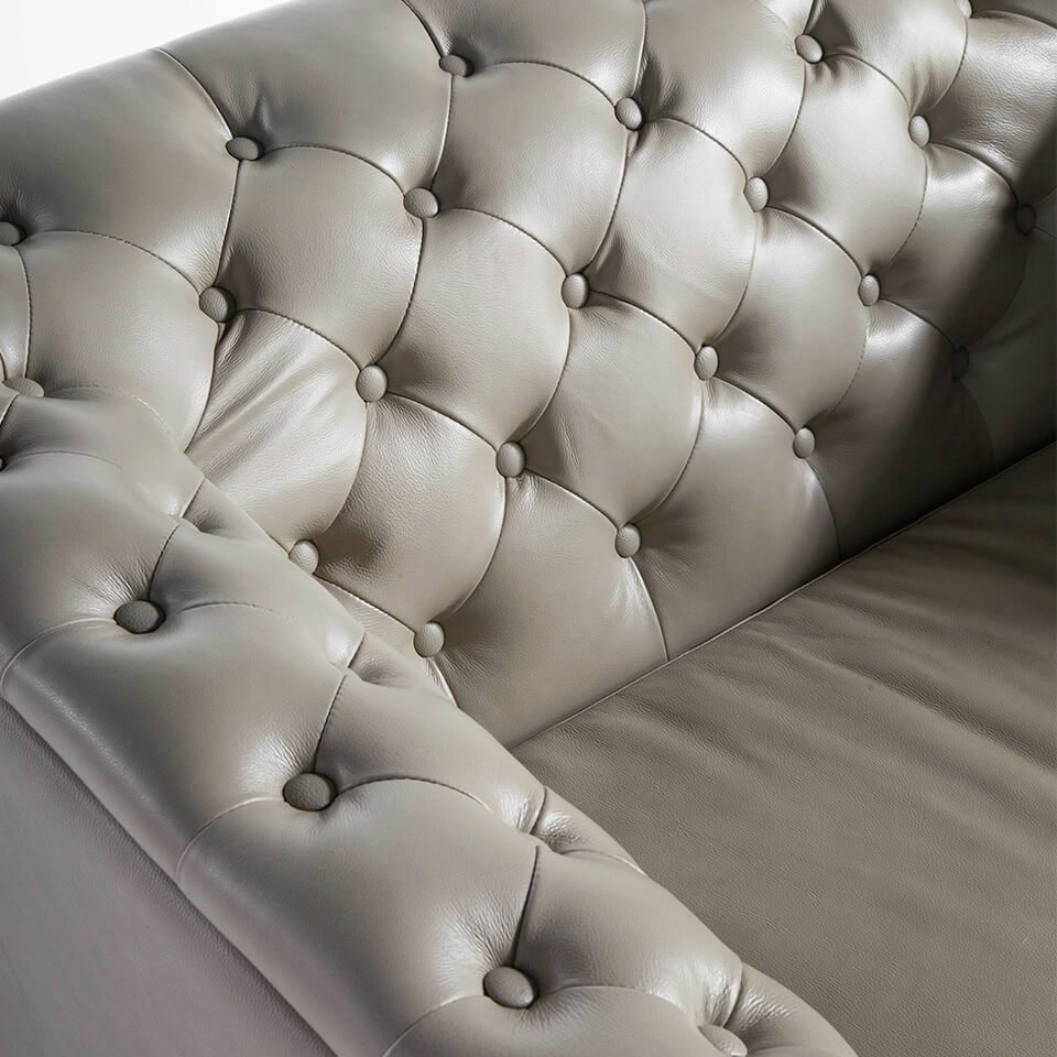 Armchair upholstered in leather witn capitone effect Armchair upholstered in leather witn capitone effect