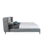Bed upholstered in fabric with Walnut wood frame
