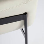 Armchair upholstered in leather and black steel legs