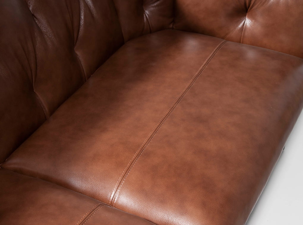 2-seater sofa upholstered in tufted leather 2-seater sofa upholstered in tufted leather