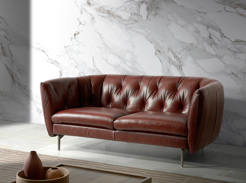 3-seater sofa upholstered in tufted leather 3-seater sofa upholstered in tufted leather