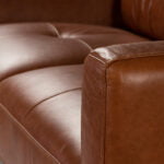 3-seater sofa upholstered in leather with Walnut wood legs
