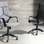 Office chair upholstered in gray fabric with armrests