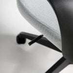 Office chair upholstered in gray fabric with armrests