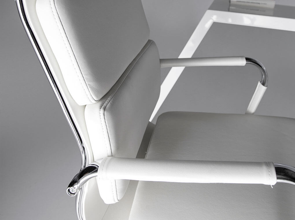Swivel office chair upholstered in white leatherette with chromed steel frame Swivel office chair upholstered in white leatherette with chromed steel frame