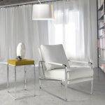 Upholstered armchair with stainless steel frame