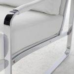 Upholstered armchair with stainless steel frame