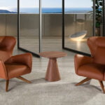 Swivel armchair upholstered in leatherette and Walnut wood legs