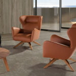 Swivel armchair upholstered in leatherette and Walnut wood legs