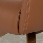 Swivel armchair upholstered in leatherette and Walnut wood legs