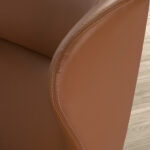 Swivel armchair upholstered in leatherette and Walnut wood legs