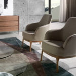 Armchair upholstered in leatherette and Walnut wood legs