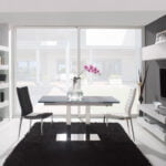 Chair upholstered in leatherette with chromed steel frame