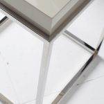 White wooden corner table and chrome steel