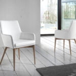 Chair upholstered in leatherette with Walnut colored wooden structure