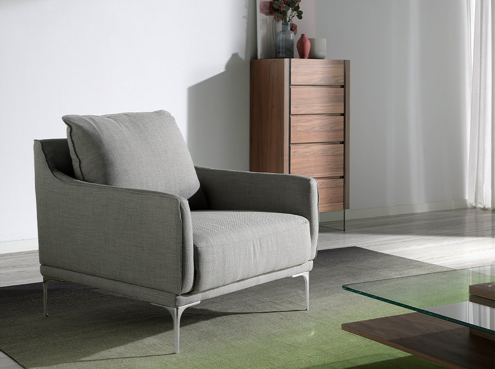 Armchair upholstered in fabric and chrome steel legs Armchair upholstered in fabric and chrome steel legs