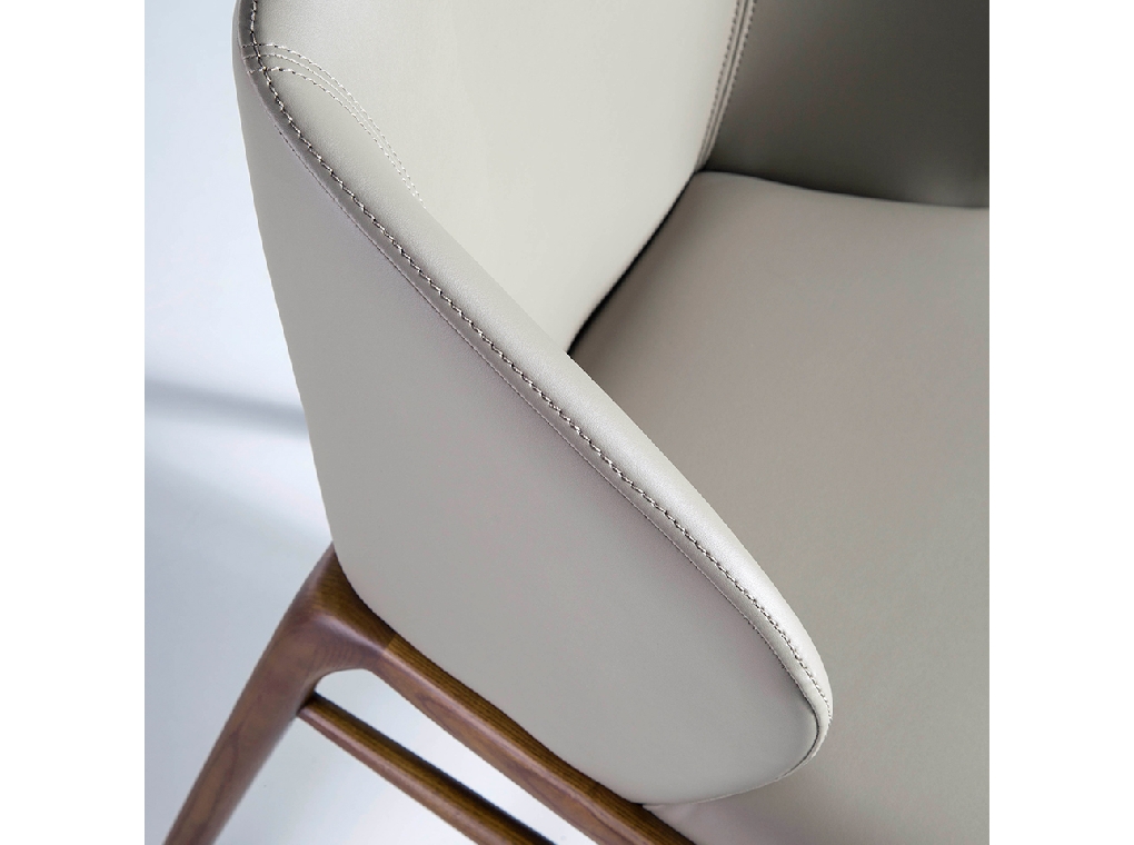 Chair upholstered in leatherette with Walnut colored wooden structure