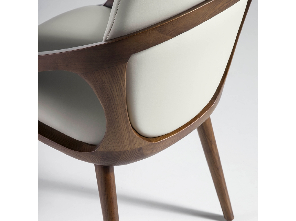 Chair upholstered in leatherette with Walnut colored wooden structure