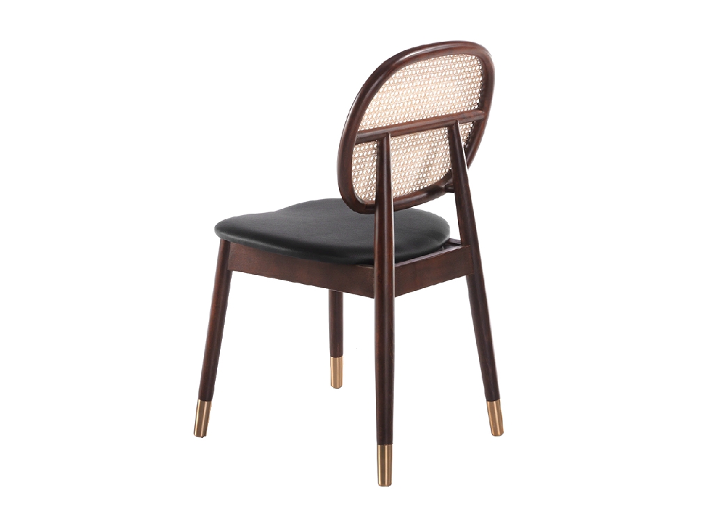 Chair upholstered in leatherette with rattan backrest and walnut wood legs