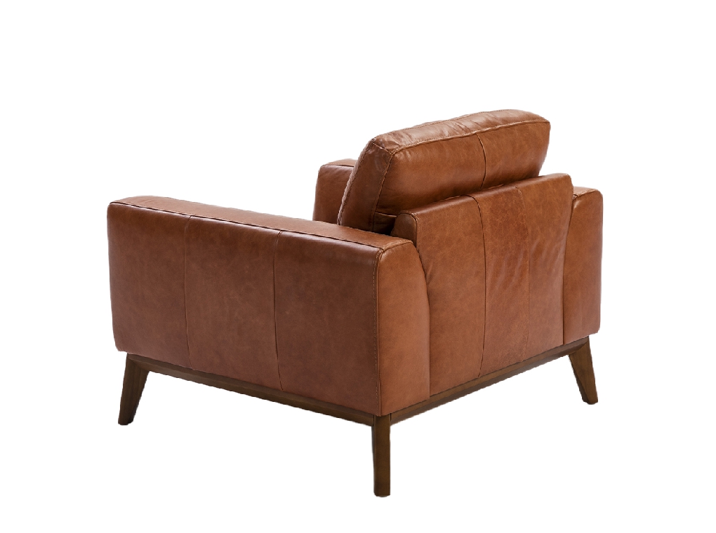 Armchair upholstered in leather and Walnut wood legs