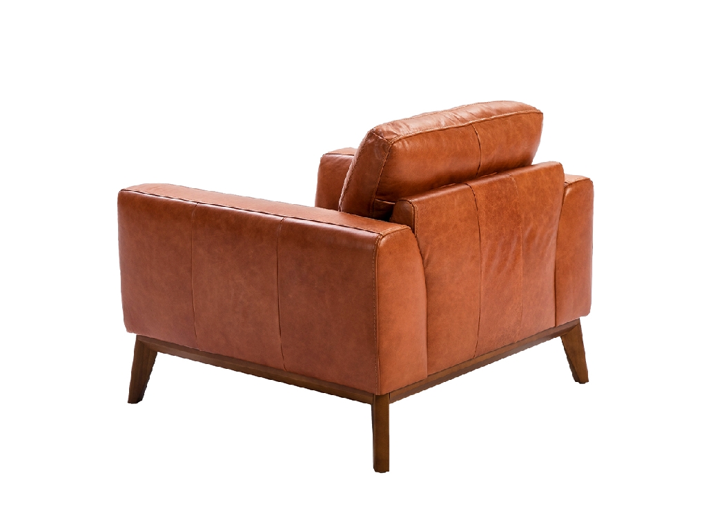 Armchair upholstered in leather and Walnut wood legs