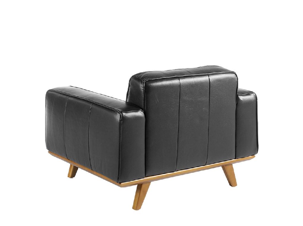 Armchair upholstered in leather and Walnut wood legs