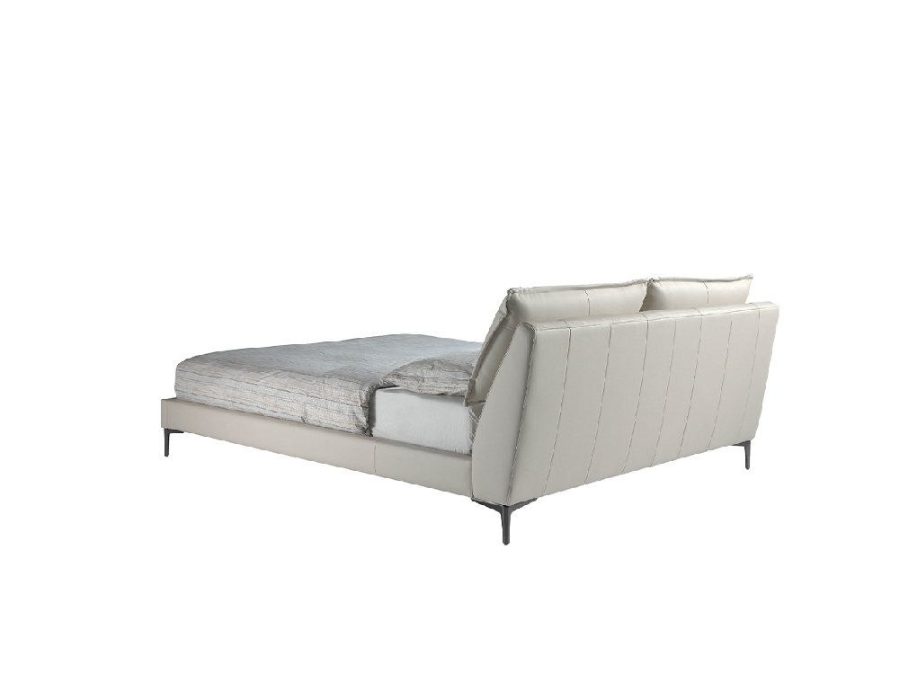 Bed upholstered in leatherette with adjustable cushions