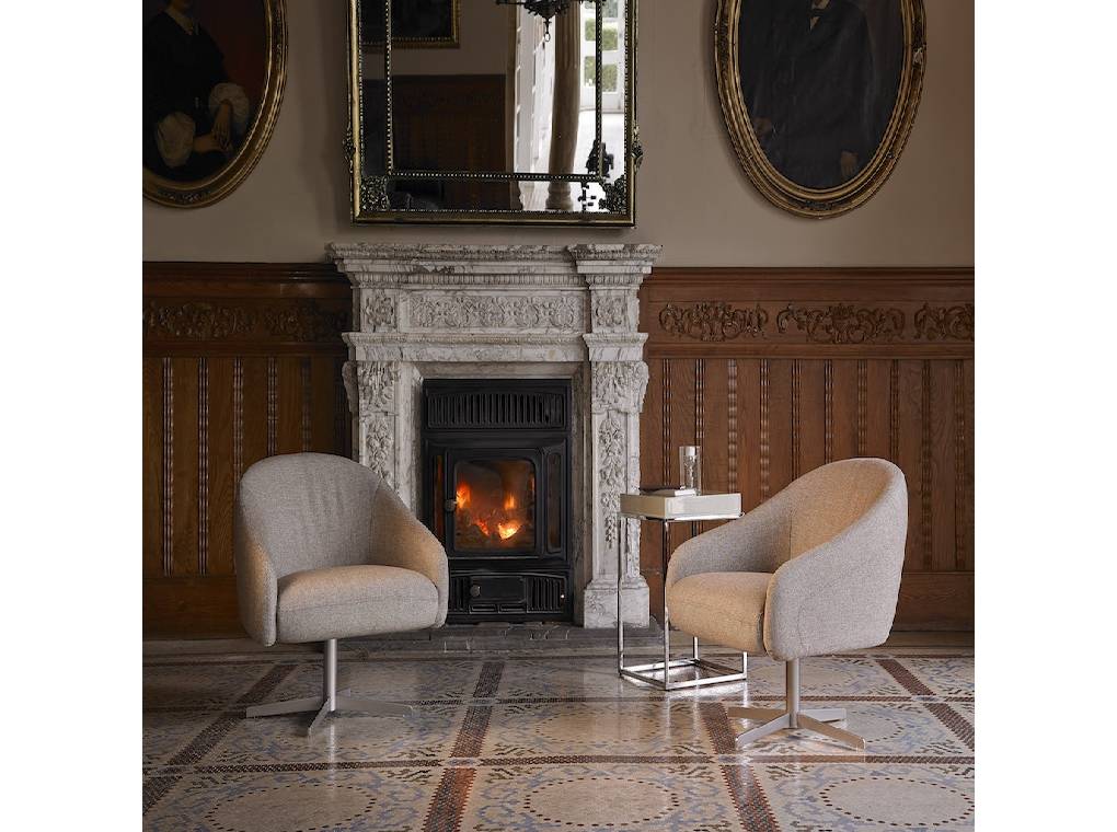 Upholstered armchair with polished stainless steel frame. Upholstered armchair with polished stainless steel frame.