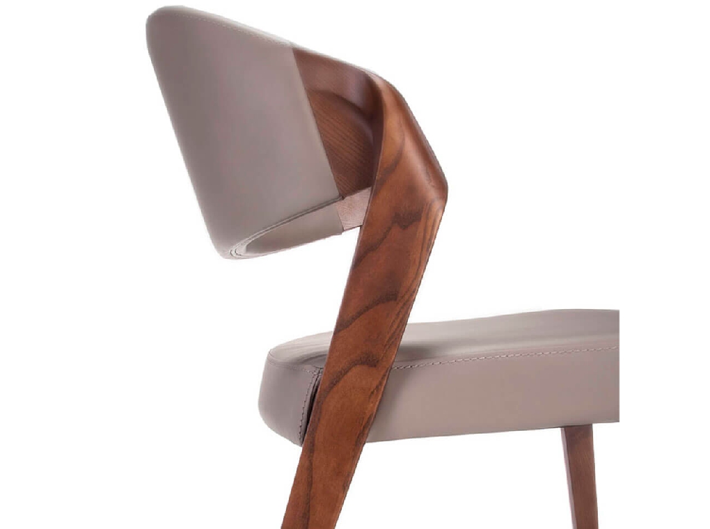 Chair upholstered in leatherette with Walnut colored wooden structure Chair upholstered in leatherette with Walnut colored wooden structure