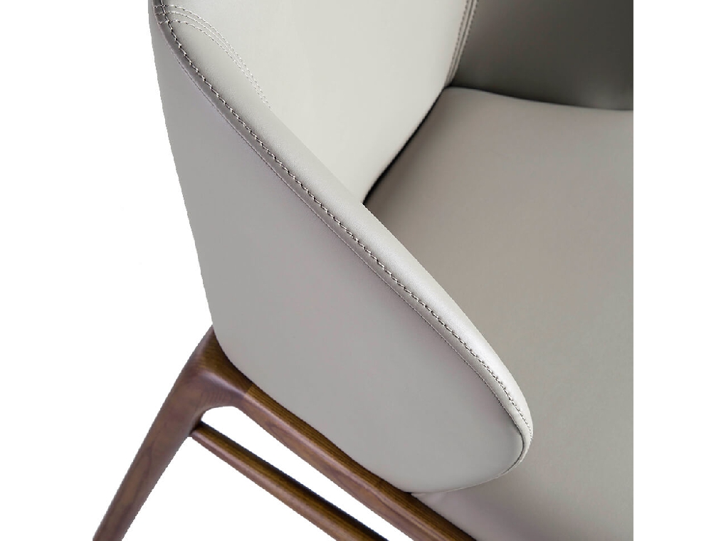 Chair upholstered in leatherette with Walnut colored wooden structure