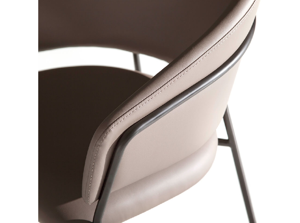 Chair upholstered in leatherette with black steel frame